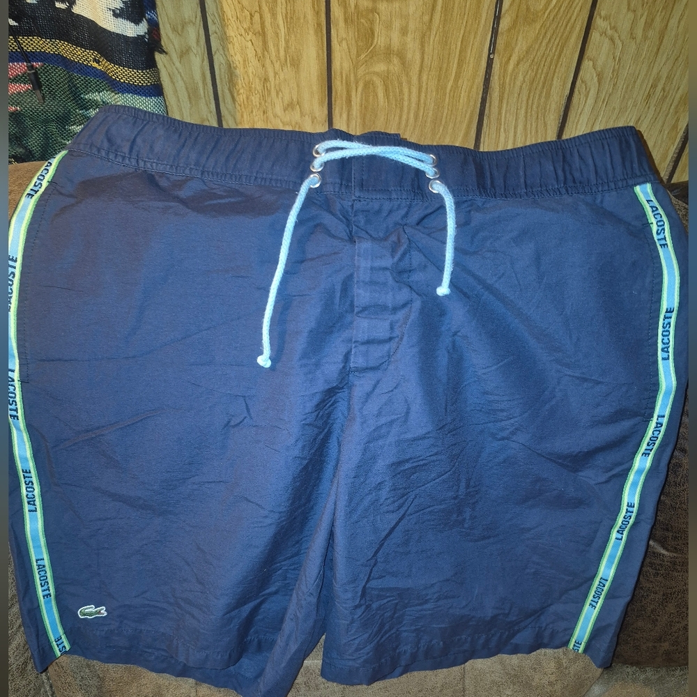 Authentic Blue Lacoste swim shorts with a light blue drawstring Size 7 Or 2xl